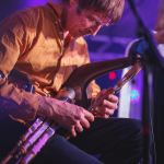 Eoin Dillon on uileann pipes during Kila's concert