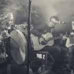 Rónán Ó Snodaigh (bodhrán) and Seanan Brennan (guitar) during Kila's performance